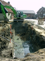 Bekijk detail van "Graafwerkzaamheden bij de ingang van winkelcentrum de <span class="highlight">Meierij</span> om ruimte te maken voor de plaatsing van glasbakken."