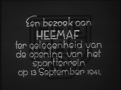 Bekijk detail van "Samenvatting: <br/>Reportage over Heemaf in Hengelo naar aanleiding van de opening van het sportterrein van de onderneming op 13 september 1941.<br/><br/>Beschrijving:<br/>00.13.34 Tekst: "Een bezoek aan Heemaf ter gelegenheid van de opening van het sportterrein op 13 september 1941"<br/>00.13.41 Beeld: Opnames van de fabrieksgebouwen en het personeel.<br/>00.14.07 Een bedrijfsgebouw in aanbouw.<br/>00.14.22 Een kijkje in de 'leerjongensafdeling'.<br/>00.15.44 Het exterieur van het in 1938 gebouwde bedrijfslaboratorium.<br/>00.15.49 Het interieur van de recent verbouwde spoelenwikkelarij, waar ook vrouwen aan het werk zijn.<br/>00.16.45 Overzicht van de werkzaamheden in de grote productiehal.<br/>00.18.21 Aandacht voor de veiligheid van de arbeiders en arbeidsters in de ponserij.<br/>00.19.29 Oefening van de bedrijfsbrandweer.<br/>00.20.33 Oefening voor een gasaanval, met medewerking van de EHBO.<br/>00.22.04 Het Rijksbureau van Voedselvoorziening verstrekt 's middag een bonloze warme maaltijd aan de werknemers. Een man op een bakfiets brengt het eten naar de kantine, waar het wordt opgediend. <br/>00.22.46 Plannen voor een nieuw waslokaal zijn in voorbereiding.<br/>00.22.54 Het personeel <span class="highlight">verlaat</span> massaal de fabriek om de opening van het <span class="highlight">nieuwe</span> sportterrein mee te maken.<br/>00.23.41 Gezicht op de volkstuinen voor werknemers, waar onder meer aardappelen worden geoogst.<br/>00.24.10 Sportbeoefening op het <span class="highlight">nieuwe</span> sportterrein, met eerst een tenniswedstrijd. 00.25.01 Directeur H.I. Keus houdt een toespraak bij de opening van het voetbalveld en verricht de aftrap, waarna wedstrijdbeelden volgen.<br/>00.30.23 Mannen nemen deel aan een koppelloop op de loopbaan rond het voetbalveld.<br/>00.31.14 Na afloop van de wedstrijden worden de spelers door de directie gehuldigd en worden er appels uitgereikt.<br/>00.32.06 Einde<br/>(N.B. Tijdcode via digibeta), 00-00-1941"